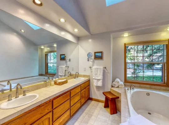 Master level ensuite bathroom. Large double sink counter perfect for 2 people. Soak in tub that can also be ideal for two people... Shower is separate from tub.